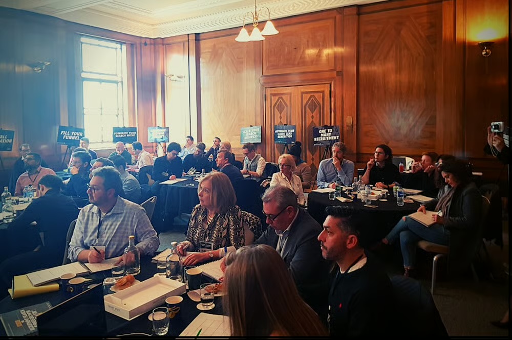 Boardroom mastermind attendees in a London venue